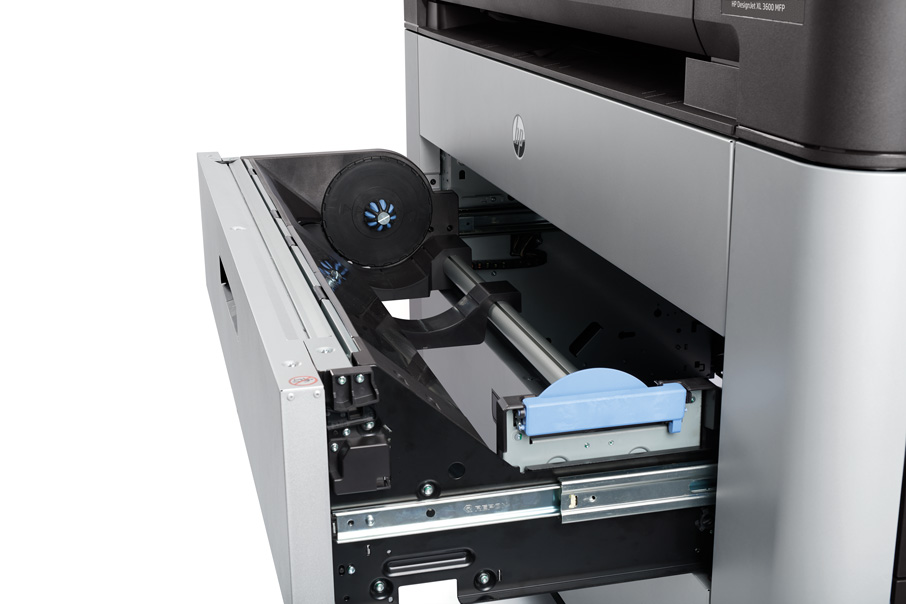 HP DesignJet XL 3600 detailed view of an open drawer showing internal media roll loading system with precision feed mechanism.