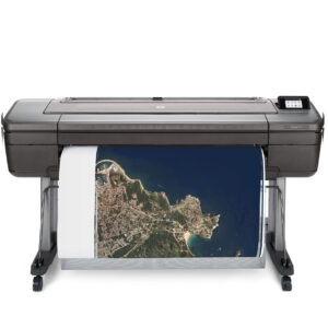 HP® DesignJet® Z9 Series Printer front-facing view printing a high-resolution aerial map with coastline and city detail.