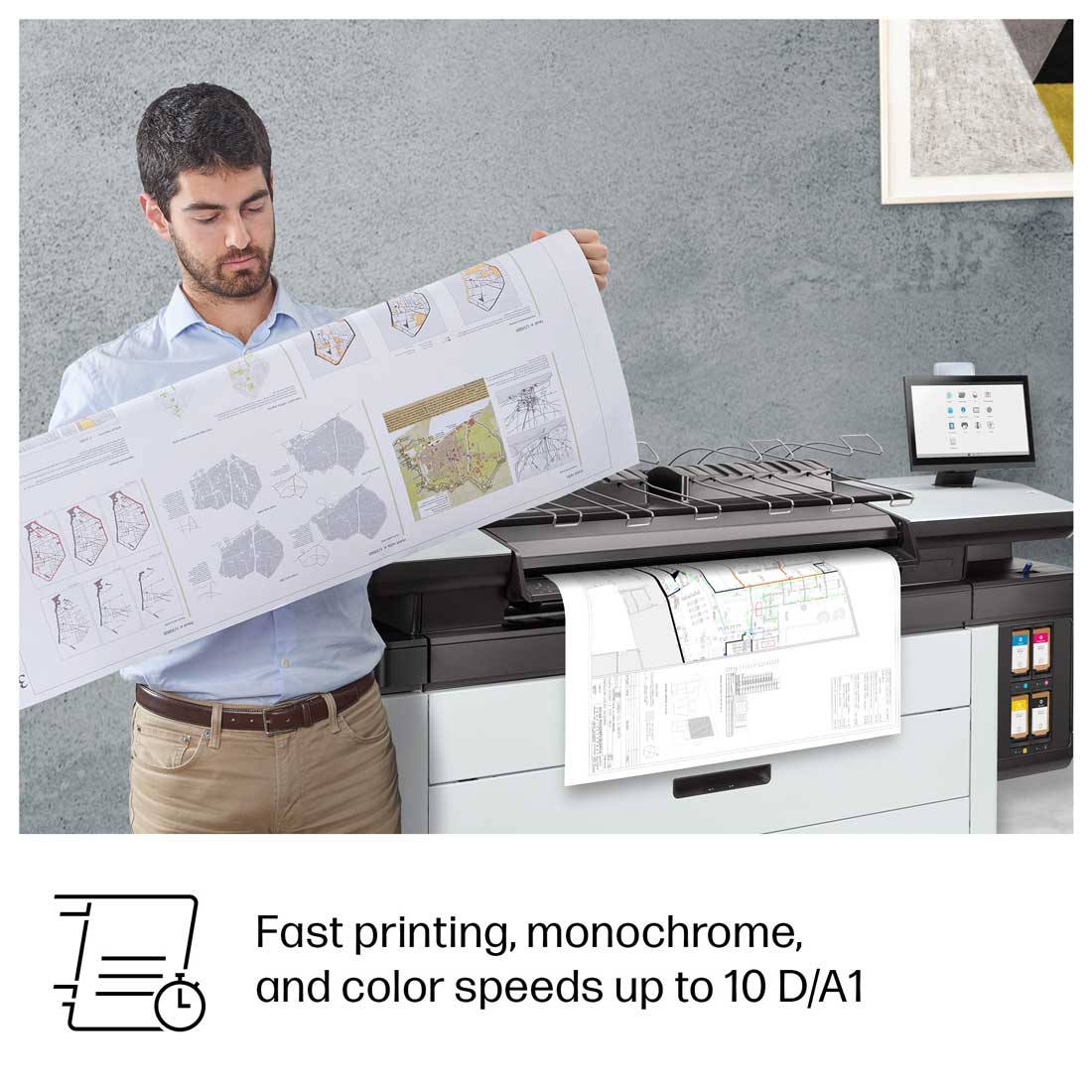 HP PageWide XL 3950 in use printing technical drawings with user reviewing full-color output on-site.