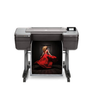 HP DesignJet Z6 prints a high-resolution fashion photograph of a woman in a red dress on a professional wide-format printer.